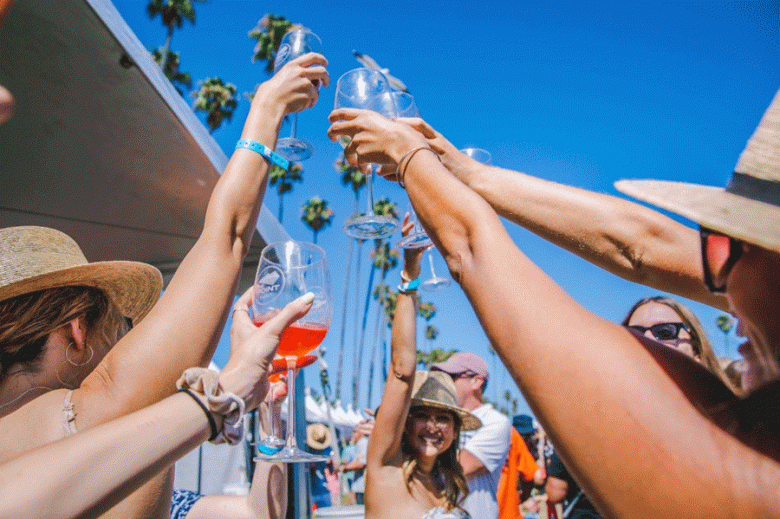 California Wine Festival attendees raise their classes in a toast. (Luis Esparza photo)