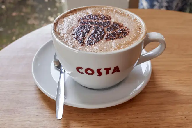 Costa Coffee cup on a table at the Costa Coffee cafe, Maybird Center, Stratford upon Avon, England UK