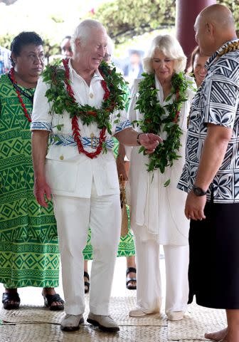 <p>Chris Jackson/Getty</p> King Charles and Queen Camilla arrive for their Samoa Cultural Village visit on Oct. 24, 2024 in Apia, Samoa