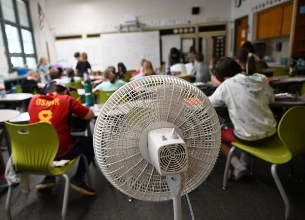 A fan moves air around in a 3rd grade classroom at Corey Elementary in Denver on Oct. 8, 2024. (Photo by RJ Sangosti/The Denver Post)