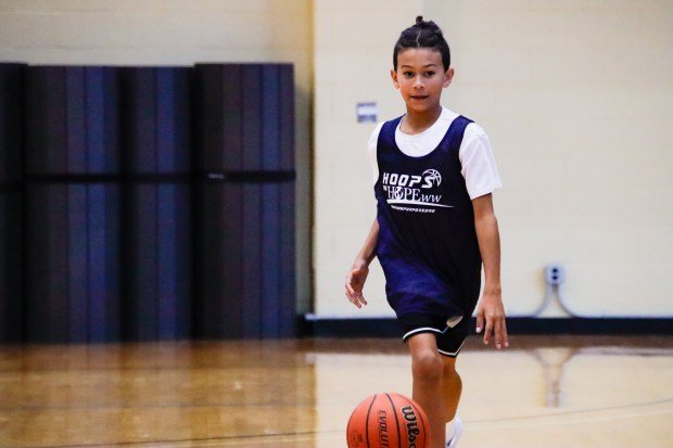 Jaxon Lemerise, of Northboro, dribbles a basketball as he runs...