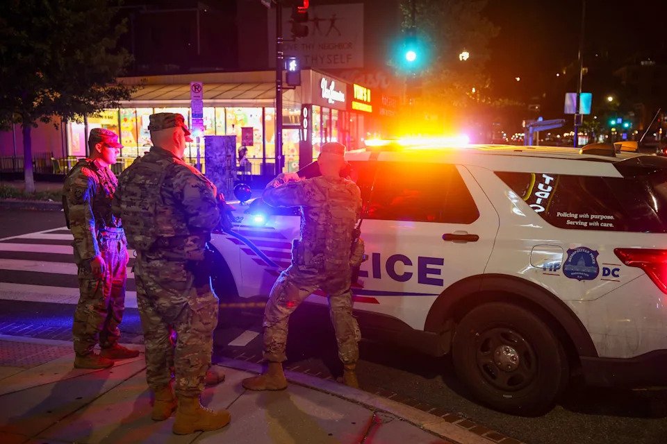 National Guard Members patrol 14th street, working with Washington DC Metro police on Aug. 24, 2025 in Washington, DC. An increased presence of law enforcement has been seen throughout the nation's capital since U.S. President Donald Trump ordered in federal officers and the U.S. National Guard.