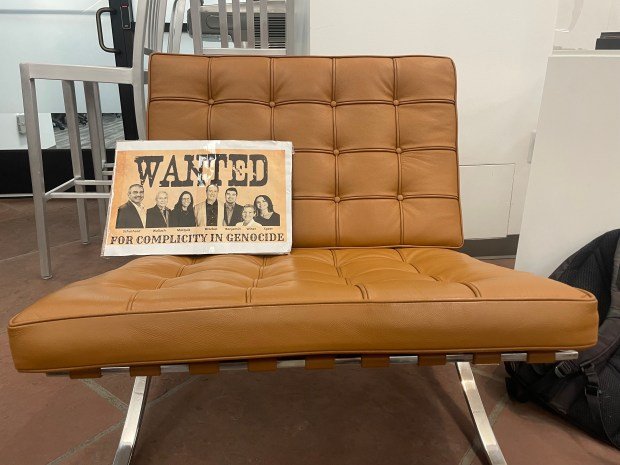A "Wanted" poster accusing eight of the nine Boulder City Council members being complicit in Israel's actions in Gaza sits on a chair in the lobby of the Penfield Tate II Municipal Building in Boulder on August 7, 2025. Boulder City Council's first open comments section in three months was marred by anger and tensions over the ongoing conflict in Gaza. (Photo by James Burky)