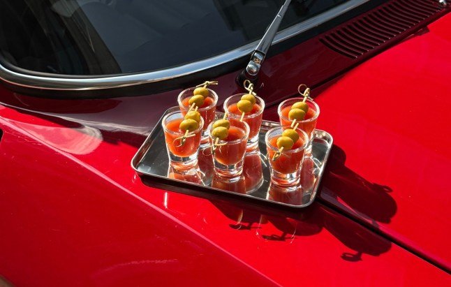 Mini cocktails on top of red car