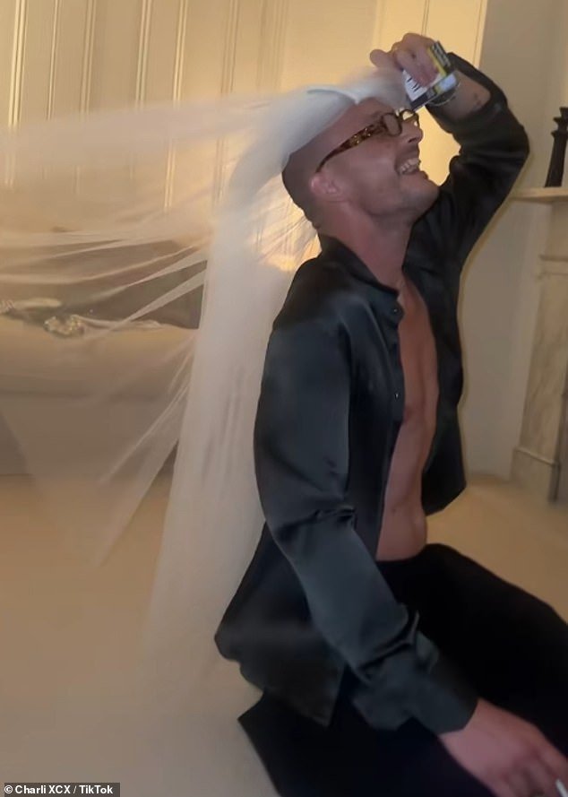 Larking around George modelled his new wife's veil while puffing on a cigarette and flashing his buff physique beneath an open shirt at the wedding afterparty
