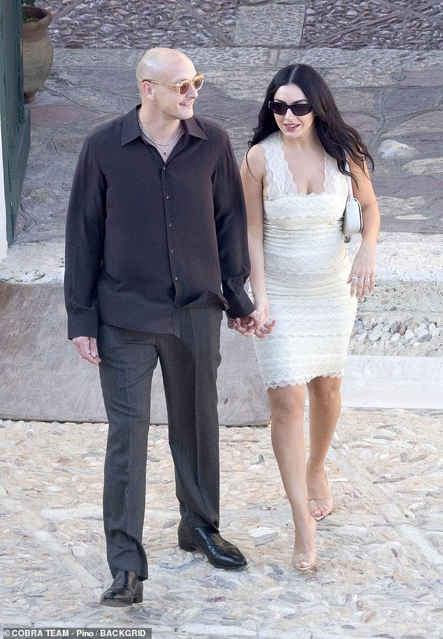 Charli XCX wore bridal white ahead of second wedding in Italy with her husband George Daniel on Friday