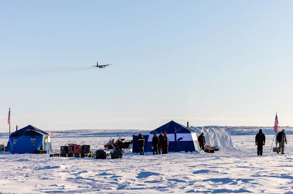 A LC-130 Hercules assigned to the 109th Airlift Wing flies over Parsons Lake, Northwest Territories, Canada, March 4. The LC-130 Hercules can land on snow and ice using skis. (U.S. Air National Guard photo by Staff Sgt. Jocelyn Tuller)