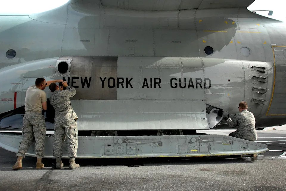 The maintenance crew with the New York Air National Guard’s 109th Airlift Wing performs its checks on a ski-equipped LC-130H following a mission to one of the remote science outposts in Greenland, July 29, 2010. <em>U.S. Air Force</em><br> FRED W. BAKER III