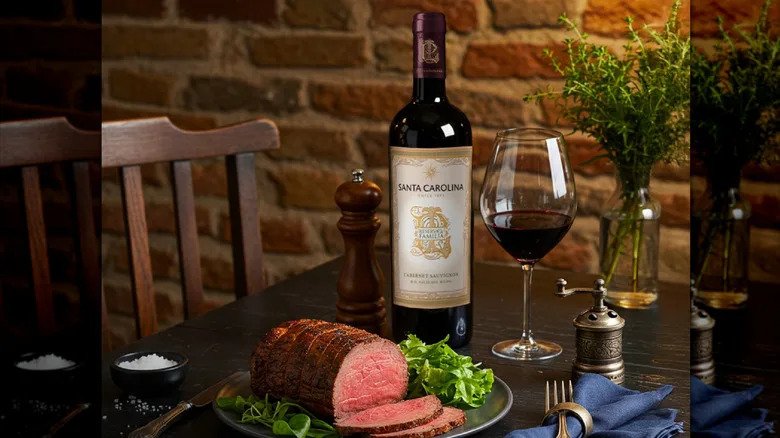 Bottle of red wine served with roast beef dinner