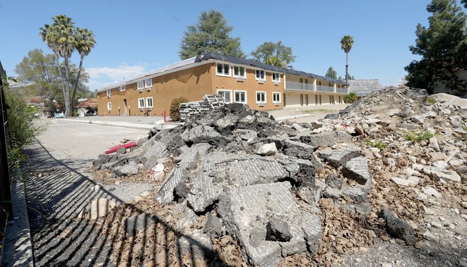 The former Quality Inn & Suites in Thousand Oaks sits amid construction rubble in March 2024. Work stopped on the project intended to be transformed by Shangri-La Industries into permanent supportive housing for the homeless. The company's CFO was arrested Oct. 16.