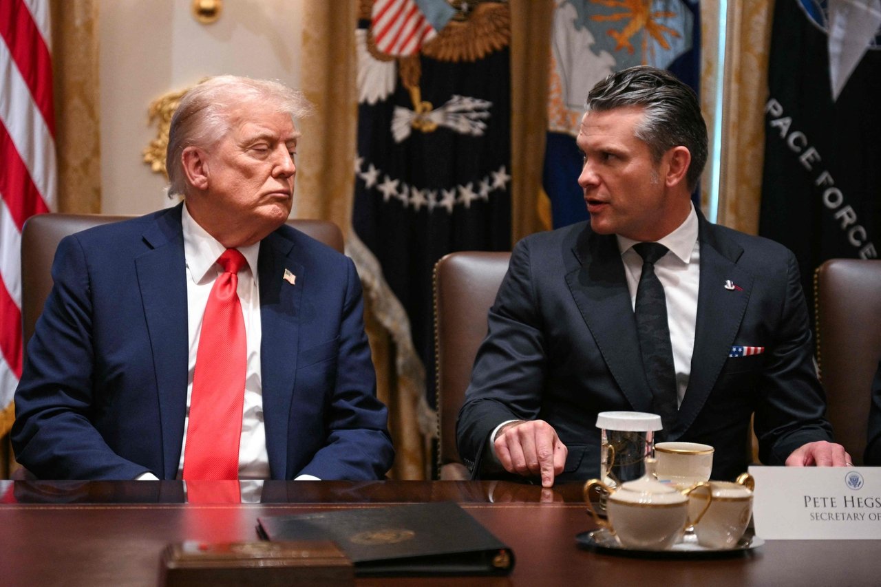 US President Donald Trump (left) and Secretary of Defense Pete Hegseth attend a Cabinet meeting in Washington, Thursday. (AFP-Yonhap)