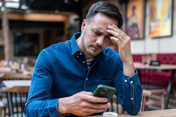 A man checks his finances