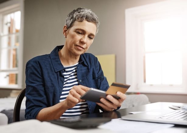 A woman checks her finances