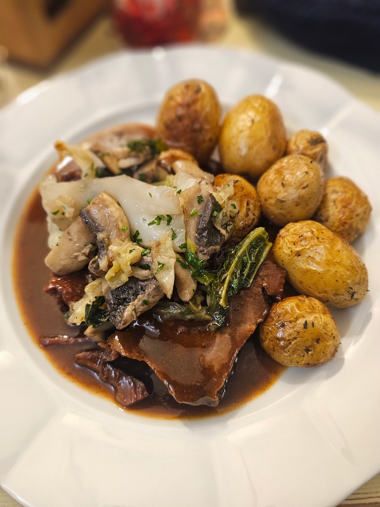 Braised beef cheeks in dark beer sauce.