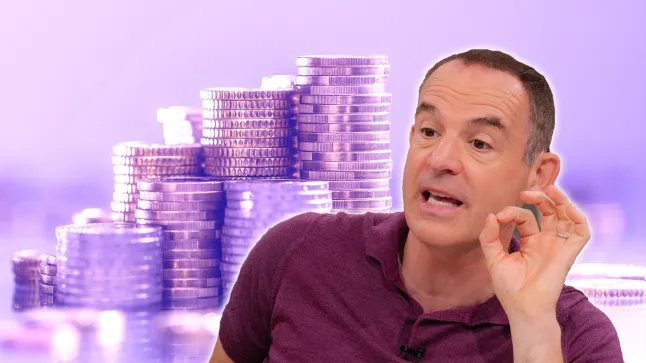 Martin Lewis wears a purple polo shirt against a purple backdrop of piles of coins.
