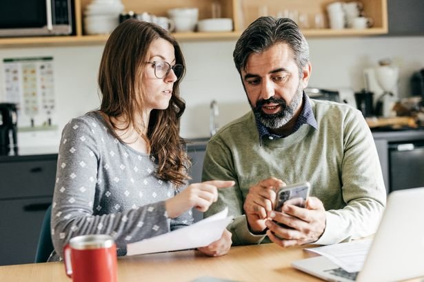 A couple check their finances