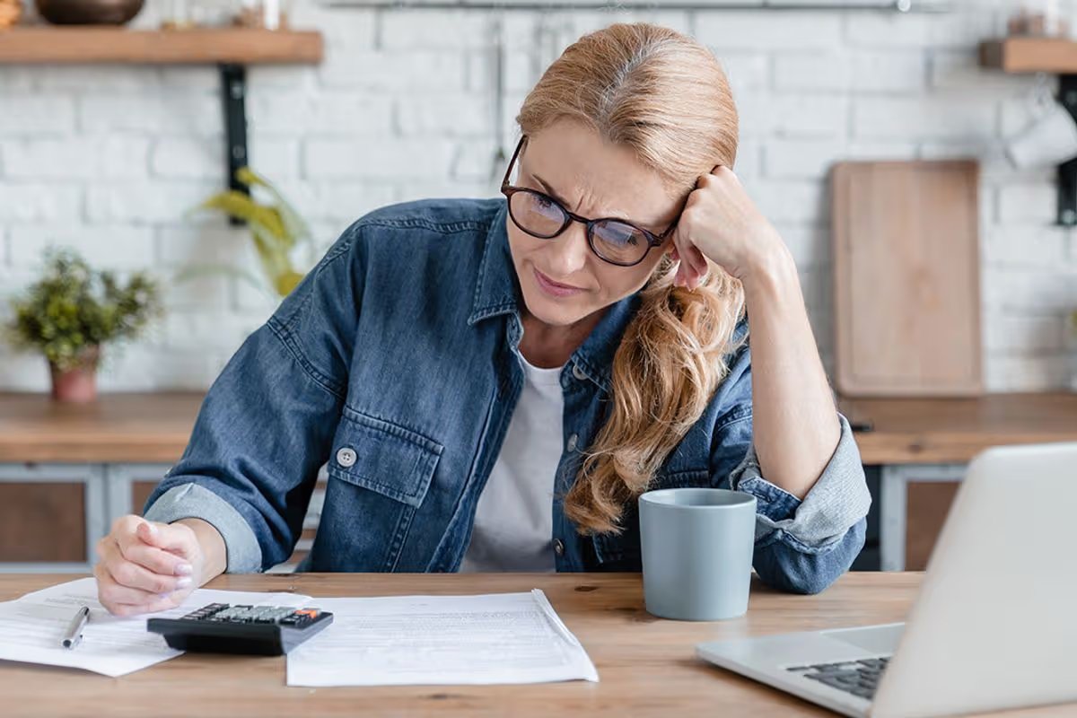A woman checks her finances