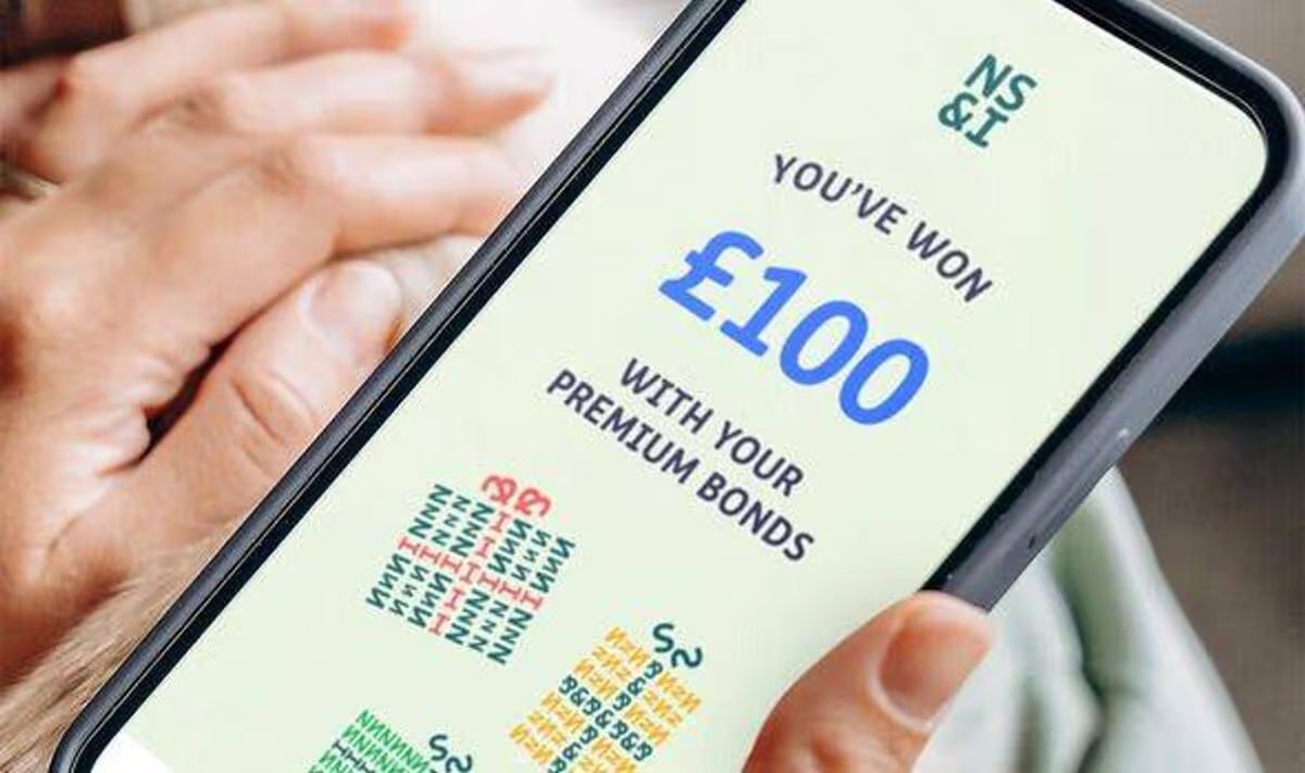 Smartphone screen showing £100 prize on Premium Bonds website