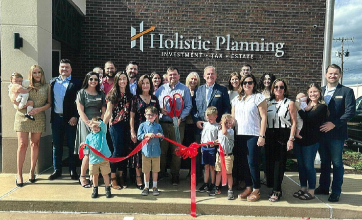 In April 2024, Holistic Planning founders Steve Barber, Jason Barber (with scissors) and Taylor Pankratz, along with the firm's employees and families, celebrated the opening of the RIA’s office in Nacogdoches, Texas.