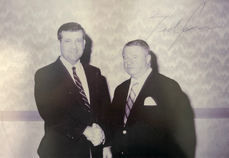Edward Jones financial advisor Paul Barber shook hands with Ted Jones in 1986 at a meeting of the Rotary Club of Nacogdoches, Texas. Barber's wife, son, daughter and two grandsons all worked at Edward Jones before they left to launch an independent registered investment advisory firm in 2023. 