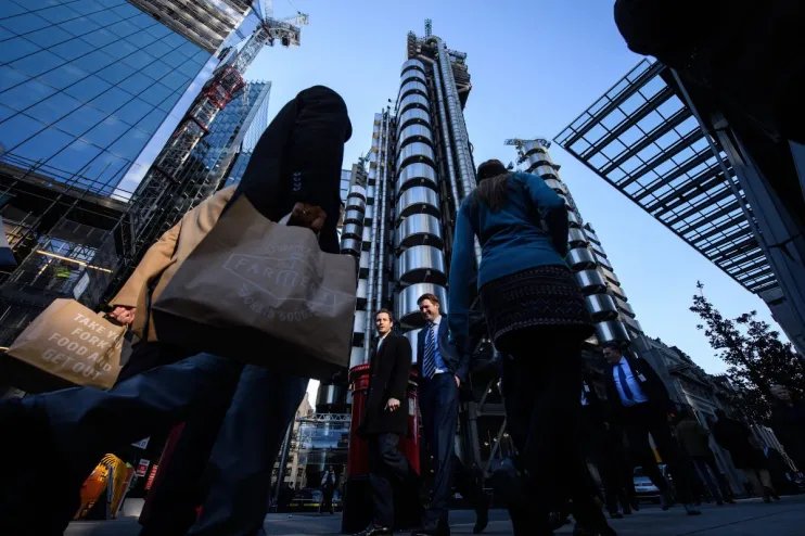 London skyline with iconic insurance buildings under clear sky reflecting the citys financial and business hub atmosphere