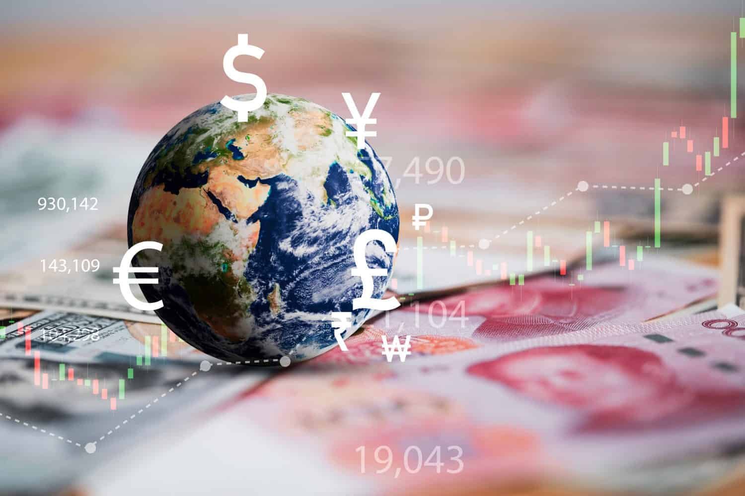 A central blue and green globe, representing Earth, is surrounded by white currency symbols including the dollar, euro, yen, pound, ruble, rupee, and won. White numerical data points are scattered around the globe. A transparent, upward-trending stock market candlestick chart with green and red bars overlays the scene, indicating market growth. The background is a blurry composition of various international banknotes, including visible US dollar bills and Chinese Yuan.