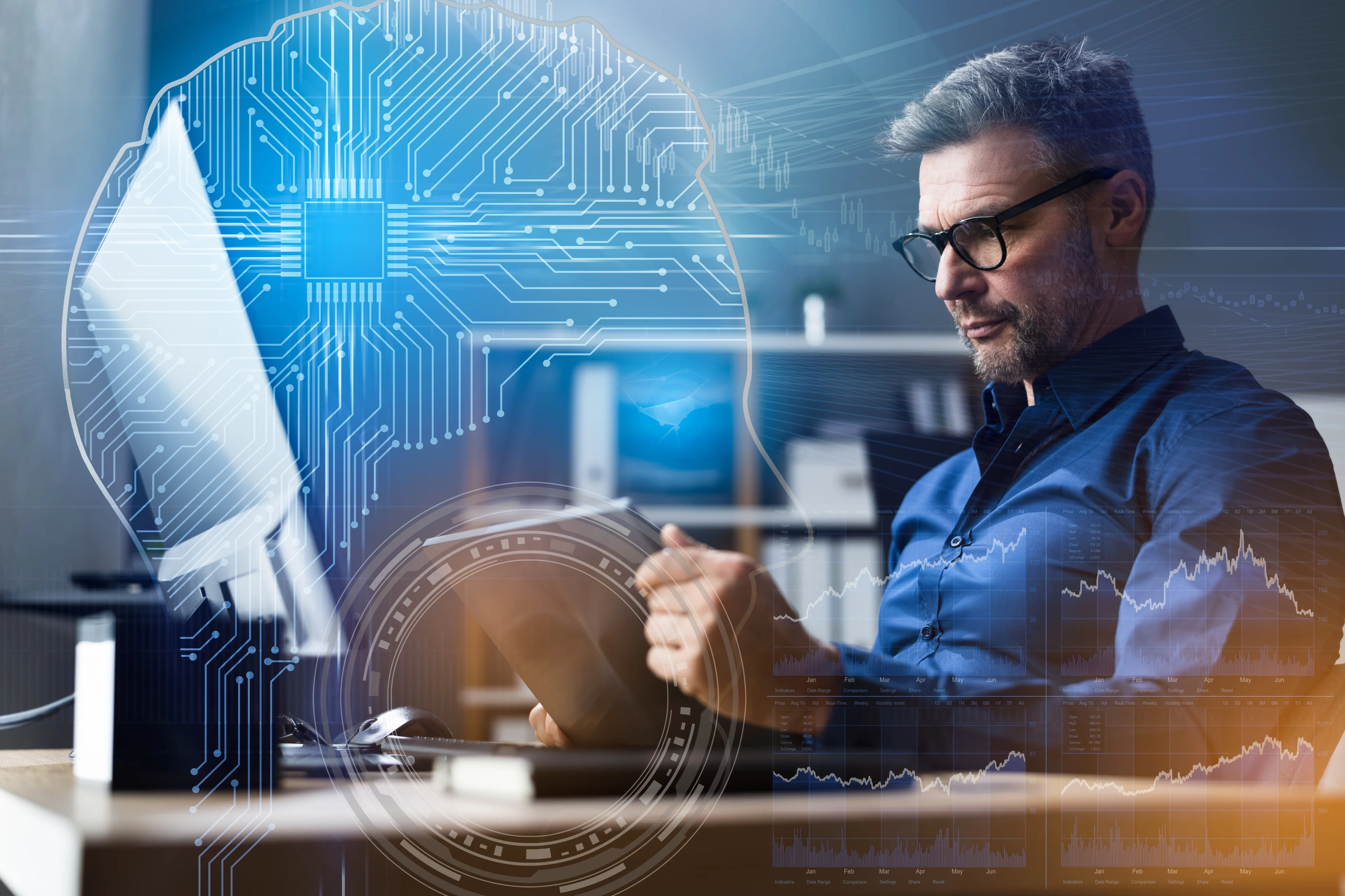 A person looking at a laptop with an image of a circuit diagram in the background.