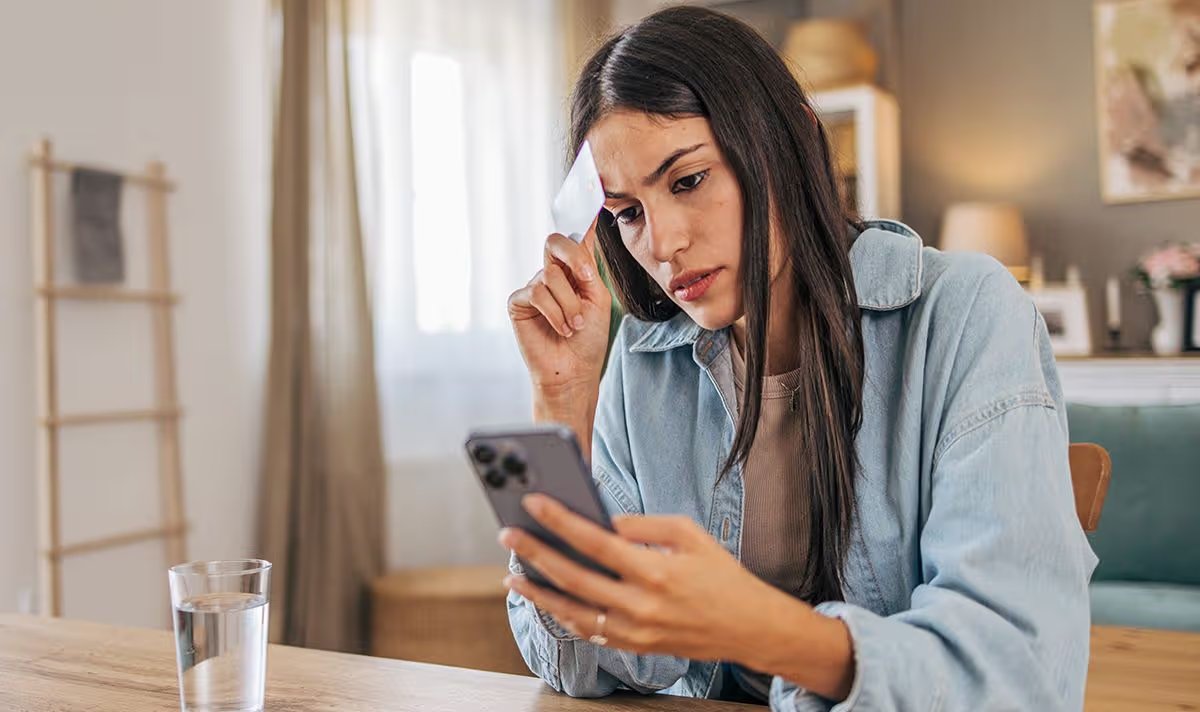A woman checks her finances