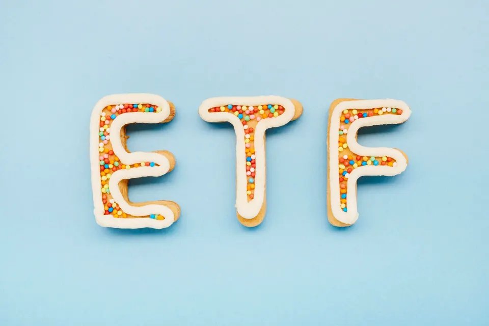 High angle view of ETF letters on blue background, symbol of investment in stocks