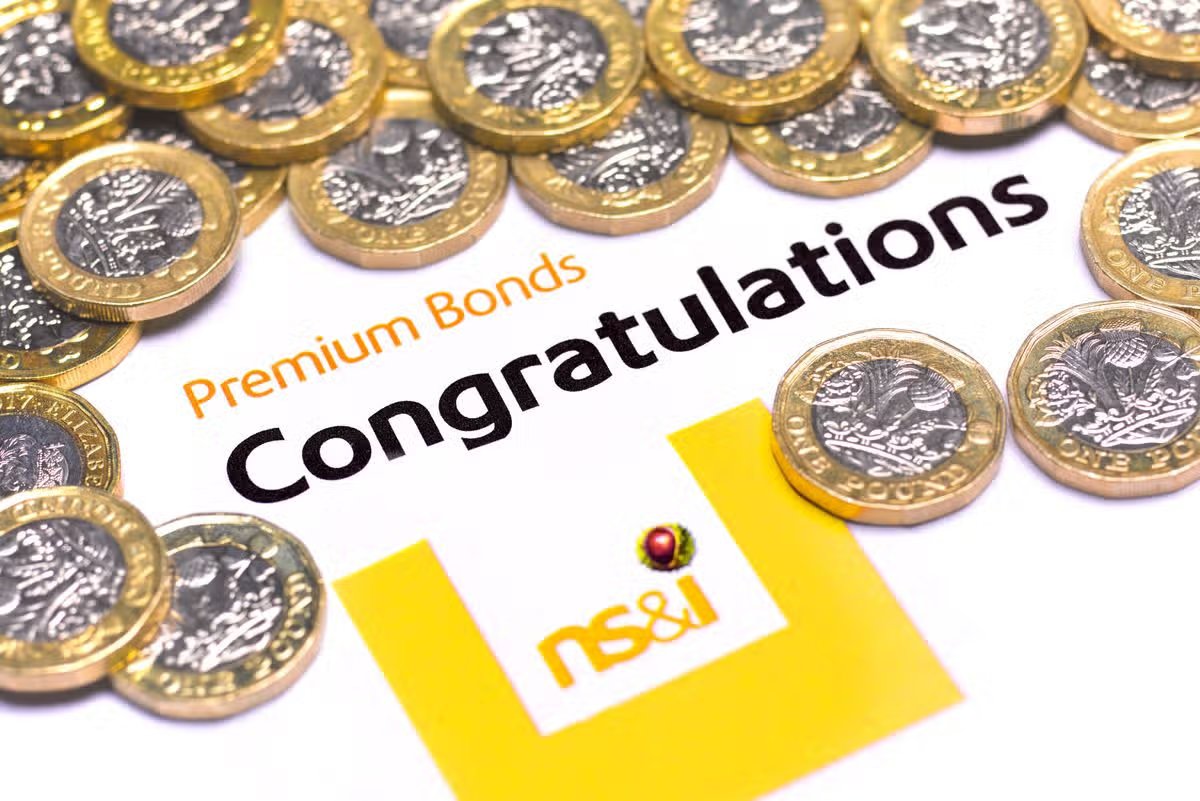 LONDON,ENGLAND - AUGUST 7:  In this photo illustration, a Premium Bond congratulatory note and pound coins on August 7,2020 in London,England. Premium Bonds are a lottery bond issued by the government's National Savings and Investments (NS&I) agency.  (Photo by Peter Dazeley/Getty Images)