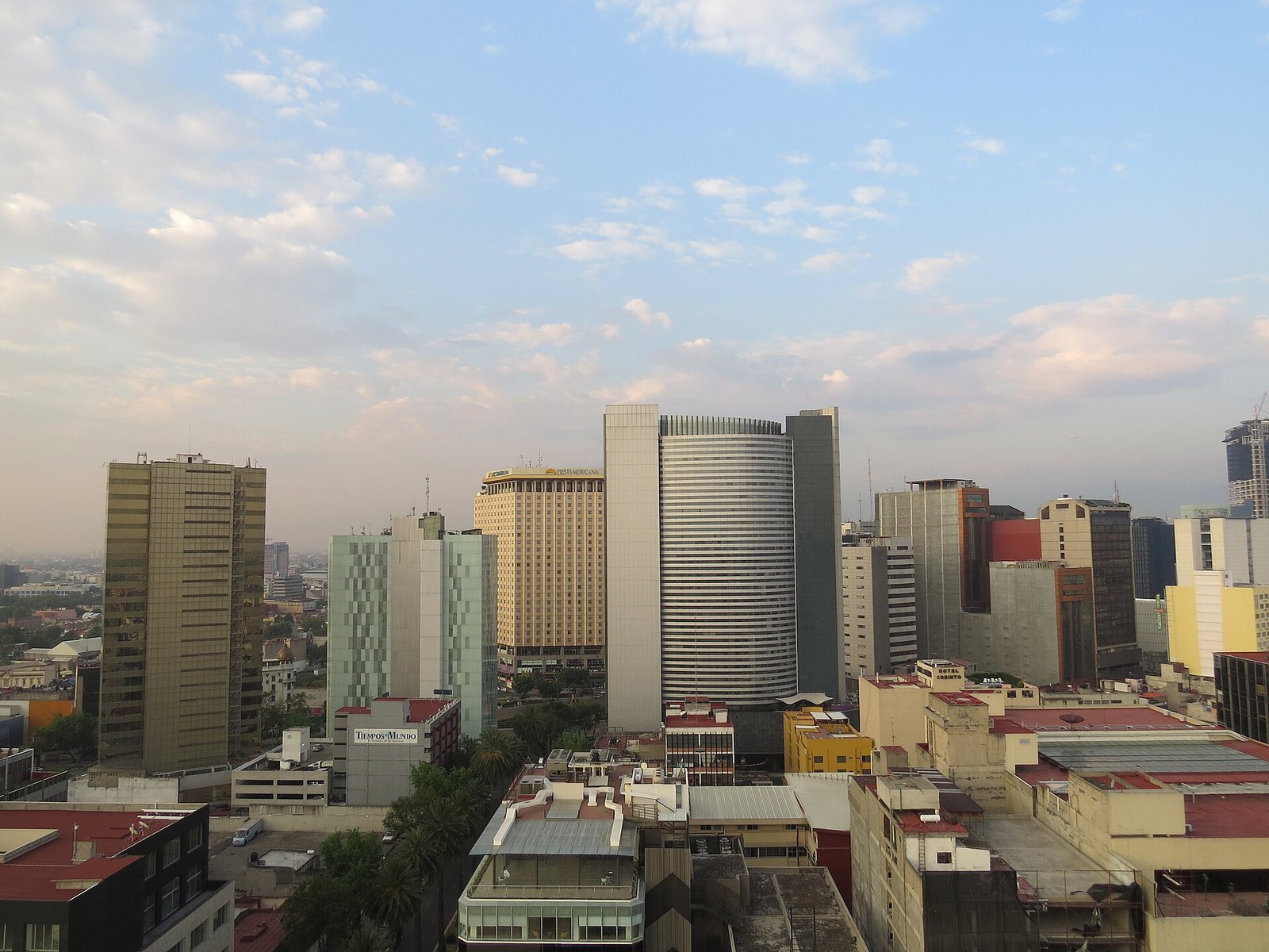 Mexico City skyline with towers on Paseo de la Reforma and mountains behind